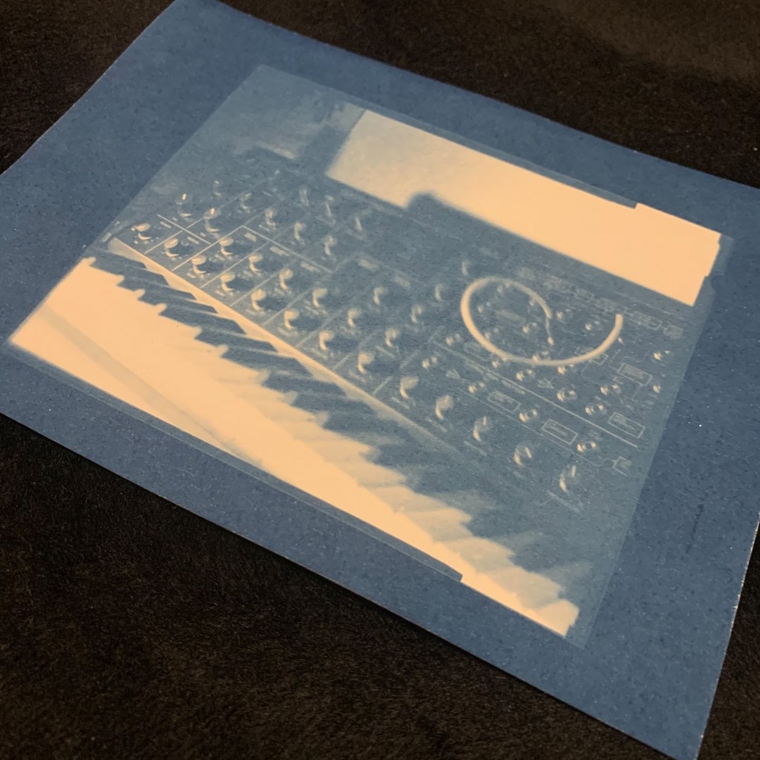 Photo of a monochrome blue cyanotype print of an analog synthesizer