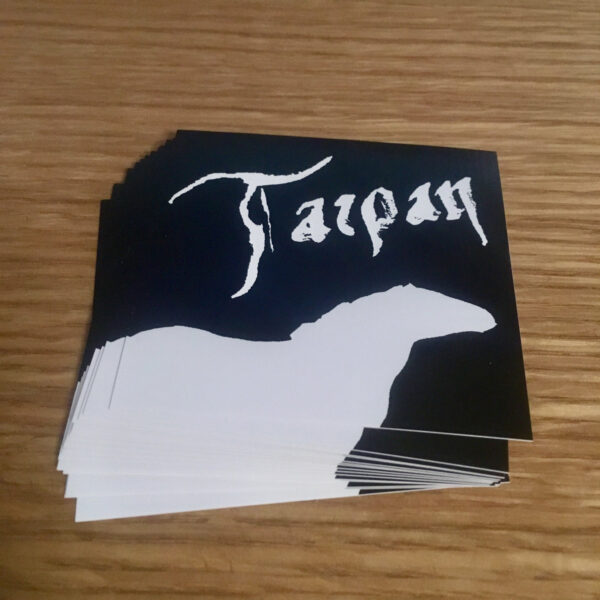 Stack of square stickers with tilted calligraphic Tarpan logo and silhouette of a tarpan (horse)